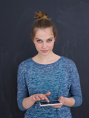 Image showing woman using tablet computer isolated over gray