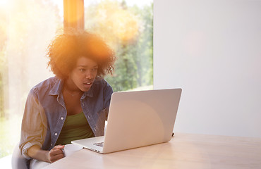 Image showing African American woman in the living room