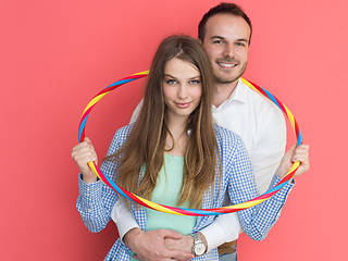 Image showing portrait of happy couple with hula hoop