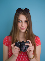 Image showing beautiful girl taking photo on a retro camera