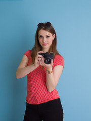 Image showing beautiful girl taking photo on a retro camera