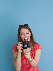 Image showing beautiful girl taking photo on a retro camera