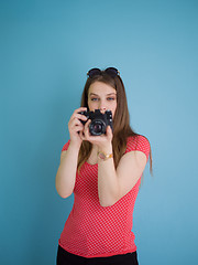 Image showing beautiful girl taking photo on a retro camera