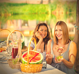 Image showing beautiful laughing women at a festive table