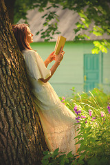 Image showing beautiful woman reading a book