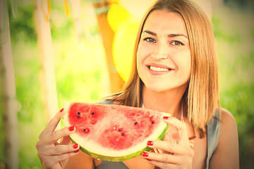 Image showing smiling woman with a slice of watermelon