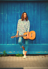 Image showing fashion. Beautiful woman with a guitar