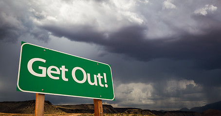 Image showing Get Out Green Road Sign and Stormy Clouds