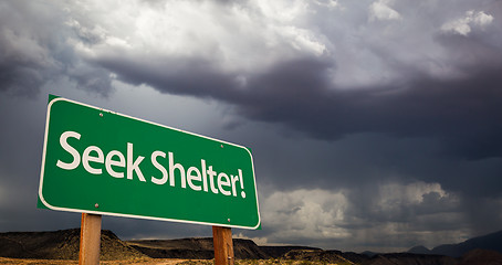 Image showing Seek Shelter Green Road Sign and Stormy Clouds