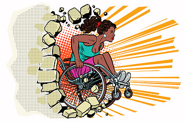 Image showing Black woman athlete in a wheelchair punches the wall