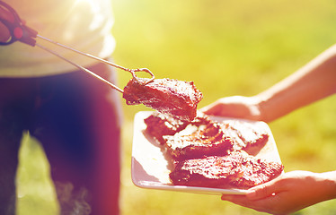 Image showing man cooking meat at summer party barbecue