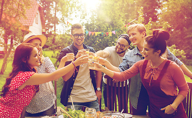 Image showing happy friends having party at summer garden