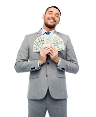 Image showing smiling businessman with american dollar money