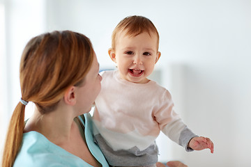 Image showing happy young mother with little baby