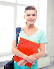 Image showing student girl with school bag and color folders