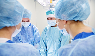 Image showing group of surgeons in operating room at hospital