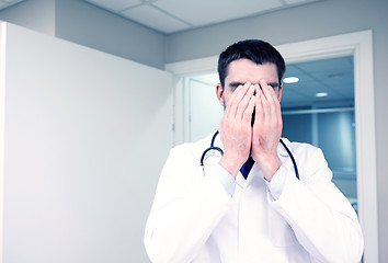 Image showing sad or crying male doctor at hospital ward