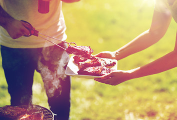 Image showing man cooking meat at summer party barbecue