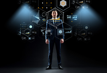 Image showing businessman in suit over virtual screen