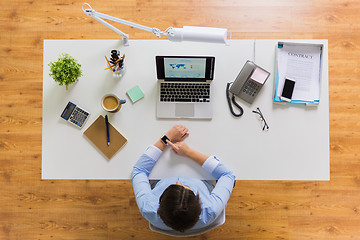 Image showing businesswoman working on laptop at office