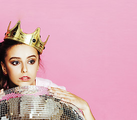 Image showing young cute disco girl on pink background with disco ball and cro