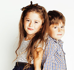 Image showing little cute boy girl hugging playing on white background, happy family close up isolated. brother and sister smiling