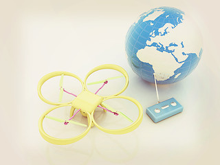 Image showing Quadrocopter Drone with Earth Globe and remote controller on a w