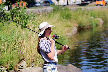 Image showing Woman with freckles and hot pants