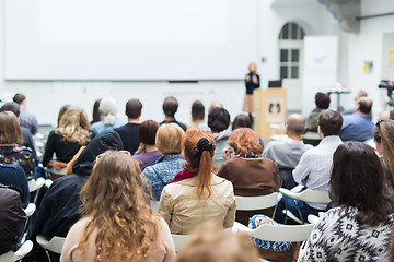 Image showing Woman giving presentation in lecture hall at university.