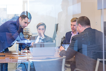 Image showing Business people sitting and brainstorming at corporate meeting.