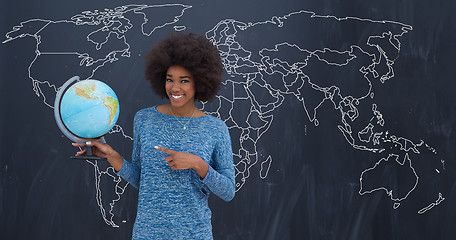 Image showing black woman holding Globe of the world