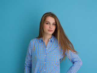 Image showing young woman playing with her long silky hair