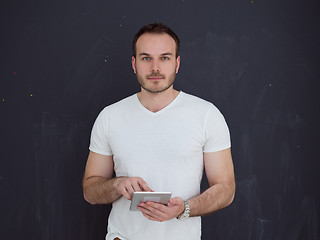 Image showing man using tablet computer isolated over gray