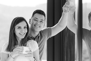 Image showing Happy two young lovers standing in living room