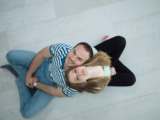 Image showing couple sitting with back to each other on floor