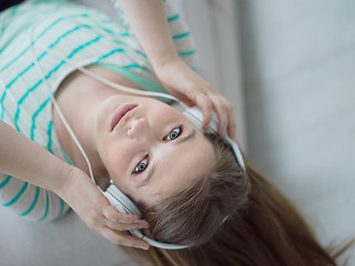 Image showing girl enjoying music through headphones