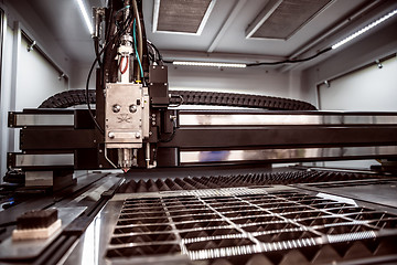 Image showing CNC Laser cutting of metal, modern industrial technology.