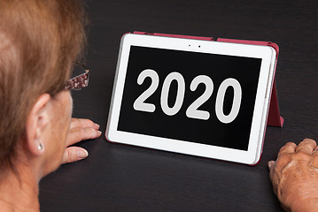 Image showing Senior lady relaxing and her tablet - 2020
