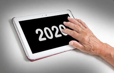 Image showing Senior lady relaxing and her tablet - 2020