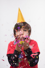 Image showing kid blowing confetti