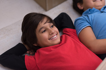 Image showing young boys having fun on the floor