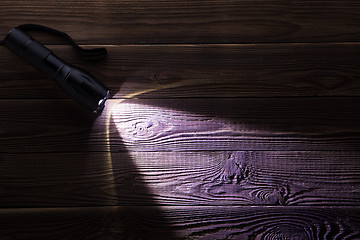 Image showing Wooden texture with glowing flashlight