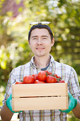 Image showing Portrait of man with tomato