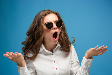 Image showing Portrait of young woman with shocked facial expression