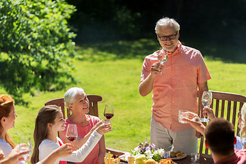 Image showing happy family having dinner or summer garden party