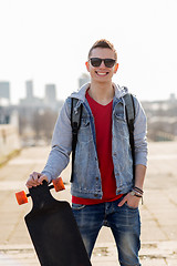 Image showing happy young man or teenage boy with longboard