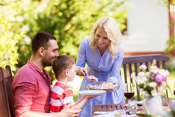 Image showing happy family having dinner or summer garden party