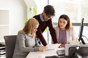 Image showing happy business team with papers in office