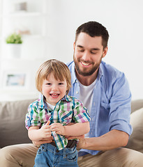 Image showing happy father with little son at home