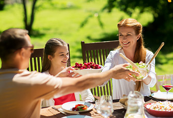 Image showing happy family having dinner or summer garden party